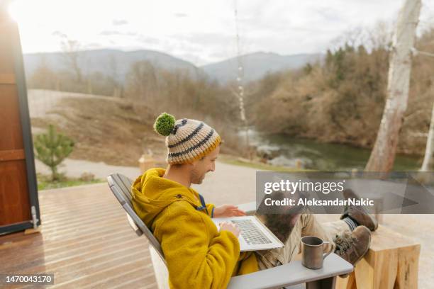 working from a remote location on lap top - holiday zoom stock pictures, royalty-free photos & images