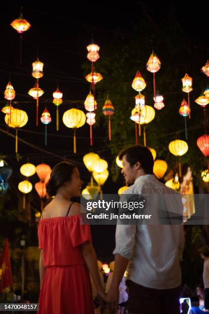 love stroll through hoi an streets - tet stock-fotos und bilder