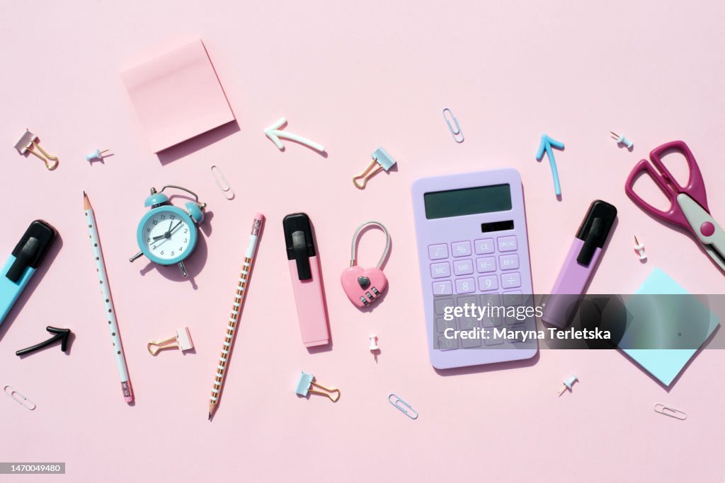 Flat lay with pink-violet office. Universal stationery office background. Stationery background. Back to school. University. Education.