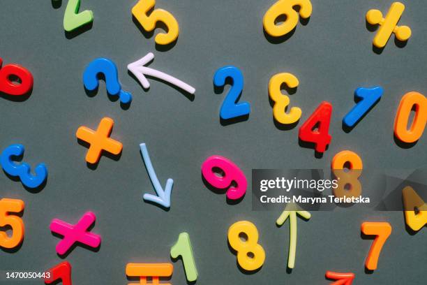 multicolored numbers on a black background. education. mathematics. finance. economy. money. - mathematics stock pictures, royalty-free photos & images