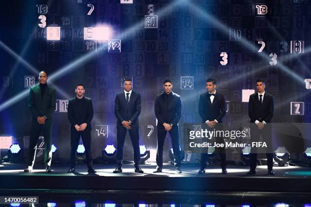 Virgil van Dijk, Lionel Messi, Kylian Mbappe, Achraf Hakimi, Casemiro and Joao Cancelo stand on stage after being included in the FIFA FIFPRO Men's...