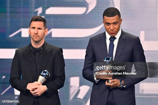 Lionel Messi and Kylian Mbappe are seen with their trophies after being included in the FIFA FIFPRO Men's World 11 2022 squad during The Best FIFA...