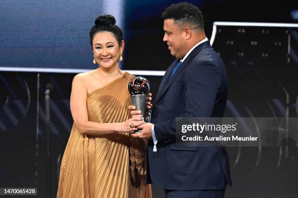 Marcia Aoki, Widow to Pele, is presented with the Best FIFA Award by Ronaldo during The Best FIFA Football Awards 2022 on February 27, 2023 in Paris,...