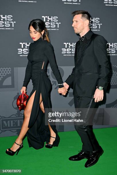 Antonella Roccuzzo and Lionel Messi pose for a photo on the Green Carpet ahead of The Best FIFA Football Awards 2022 on February 27, 2023 in Paris,...