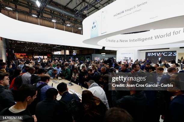 Guests view the newest Honor smartphone, Honor Magic5 Pro, during its presentation on day 1 of Mobile World Congress 2023 at Fira Barcelona on...