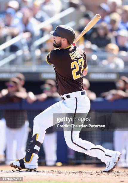 David Dahl of the San Diego Padres hits a sing against the Los Angeles Dodgers during the first inning of the spring training game at Peoria Stadium...