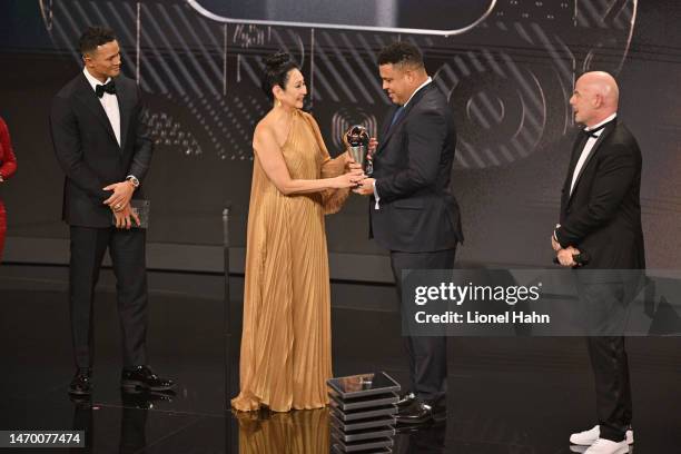 Marcia Aoki, Widow to Pele, is presented with the Best FIFA Award by Ronaldo during The Best FIFA Football Awards 2022 on February 27, 2023 in Paris,...