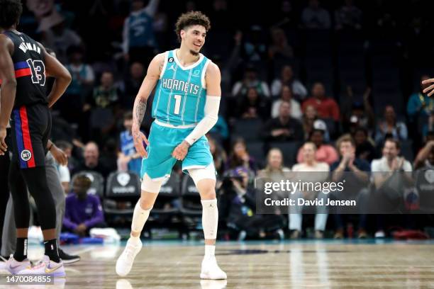 LaMelo Ball of the Charlotte Hornets reacts after making a three pointer during the first half of their basketball game against the Detroit Pistons...