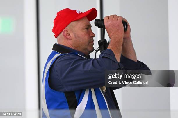 Trainer Peter Moody is seen watching Incentivise through his binoculars in a barrier trial at Pakenham Racecourse on February 28, 2023 in Melbourne,...