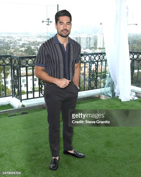 Cotrona poses at the Photo Call For Warner Bros. "Shazam! Fury Of The Gods" at The London West Hollywood at Beverly Hills on February 27, 2023 in...