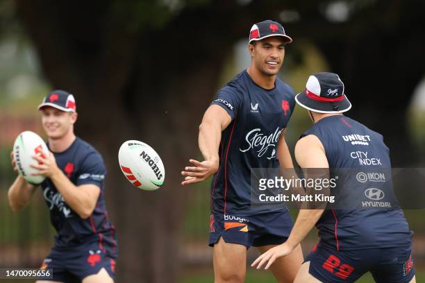 Joseph Suaalii passes during a Sydney Roosters NRL training session at Kippax Lake on February 28, 2023 in Sydney, Australia.