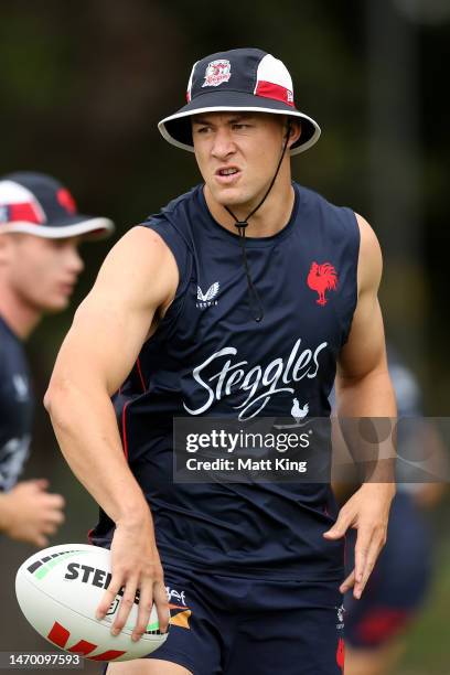 Joseph Manu handles the ballduring a Sydney Roosters NRL training session at Kippax Lake on February 28, 2023 in Sydney, Australia.