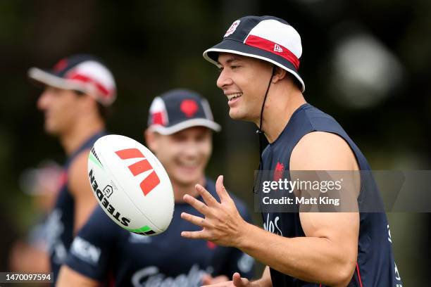 Joseph Manu handles the ball during a Sydney Roosters NRL training session at Kippax Lake on February 28, 2023 in Sydney, Australia.