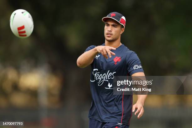 Joseph Suaalii passes during a Sydney Roosters NRL training session at Kippax Lake on February 28, 2023 in Sydney, Australia.