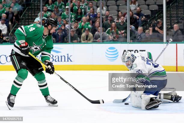 Jamie Benn of the Dallas Stars scores a goal against Thatcher Demko of the Vancouver Canucks in the first period at American Airlines Center on...