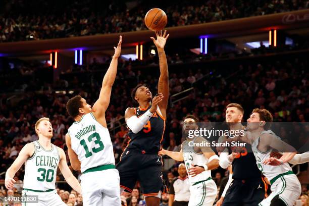 Barrett of the New York Knicks goes to the basket as Malcolm Brogdon of the Boston Celtics defends during the second half at Madison Square Garden on...