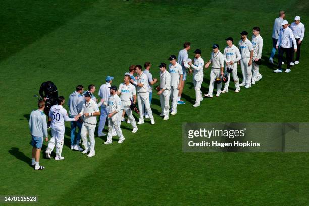 Players shake hands at conclusion of the match during day five of the Second Test Match between New Zealand and England at Basin Reserve on February...