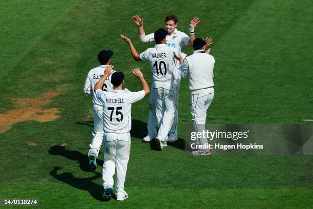 Neil Wagner and Tim Southee of New Zealand celebrate after taking a catch to dismiss Ben Foakes of England during day five of the Second Test Match...