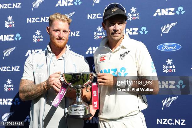 Ben Stokes of England and Tim Southee of New Zealand share the trophy following day five of the Second Test Match between New Zealand and England at...