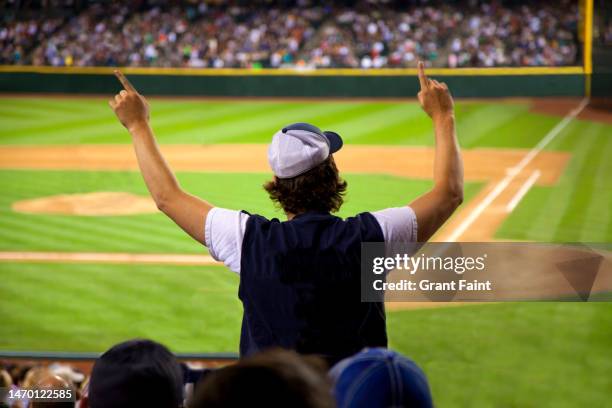 young male at baseball game. - boomwa stock pictures, royalty-free photos & images