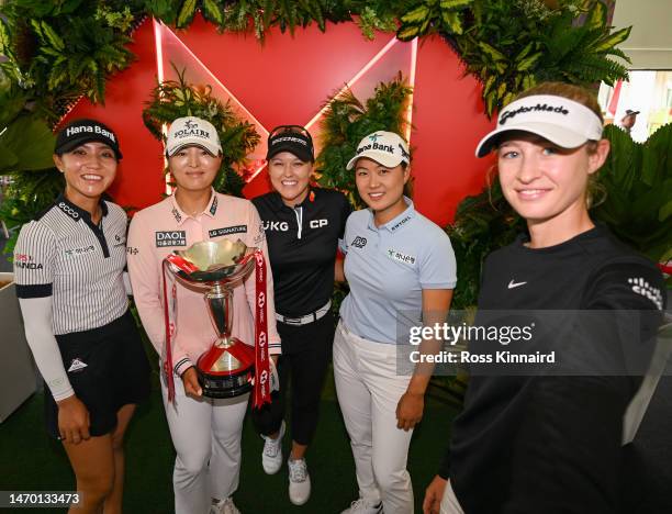 Nelly Korda of The United States imitates a “selfie” as she poses with Lydia Ko of New Zealand, Jin Young Ko of South Korea, Brooke Henderson of...