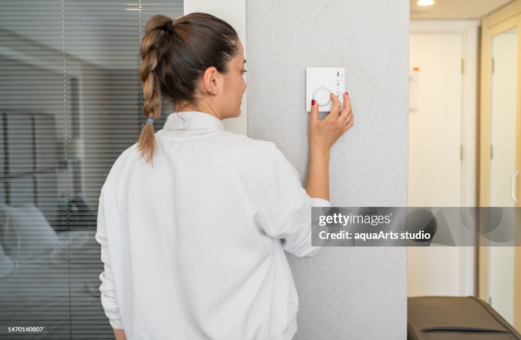 The Woman Who Adjusts The Room Temperature From The Air Conditioning Panel