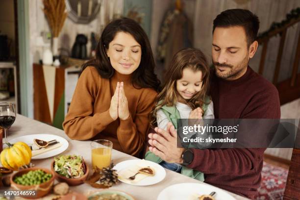 praying before lunch! - saying grace stock pictures, royalty-free photos & images