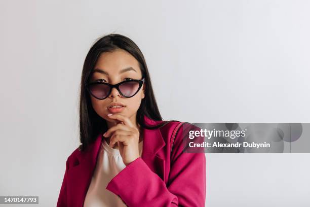 asian woman in sunglasses on white background - catalogue stock pictures, royalty-free photos & images