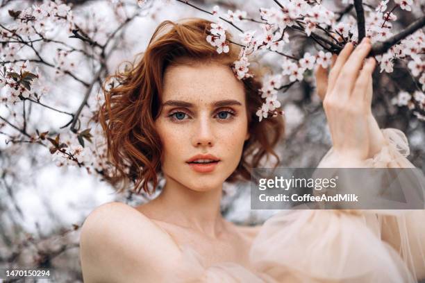 beautiful girl on the background of spring bush - short trees bildbanksfoton och bilder