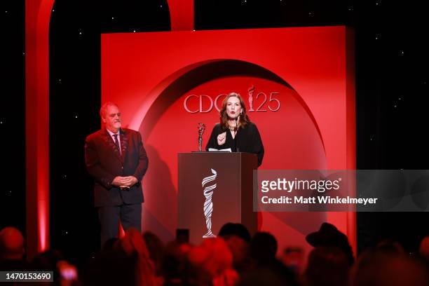 Deborah Lynn Scott accepts the Career in Film award from Jon Landau onstage during the 25th Annual Costume Designers Guild Awards at Fairmont Century...