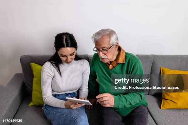 you can also read news here - hands holding tablet a pair of glasses stock pictures, royalty-free photos & images