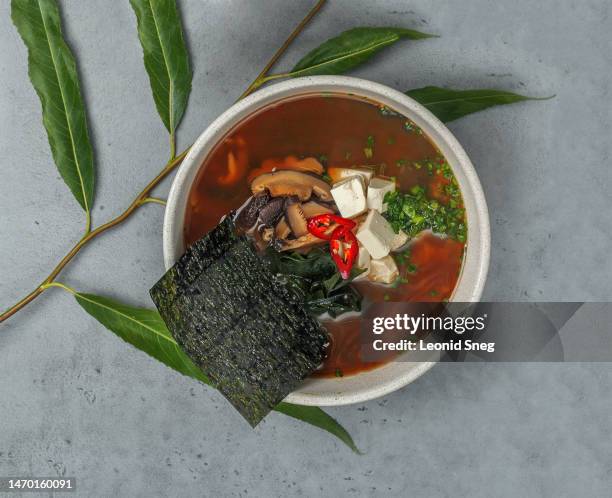 miso soup on gray background - kelp stock-fotos und bilder