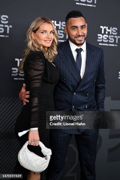 Dimitri Payet and Ludivine Payet pose for a photo on the Green Carpet ahead of The Best FIFA Football Awards 2022 on February 27, 2023 in Paris,...