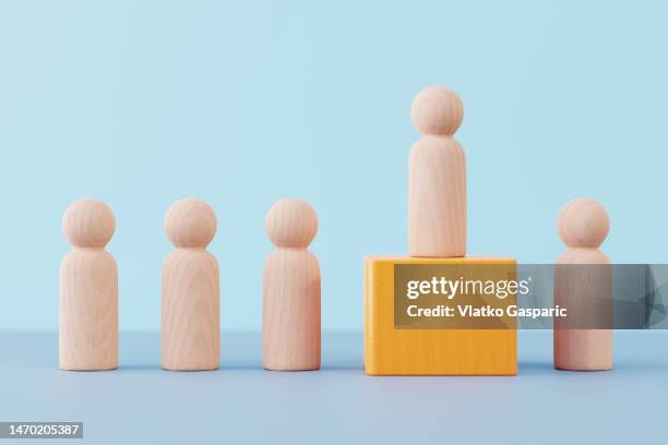 leader figure standing above others - winning candidate stock pictures, royalty-free photos & images
