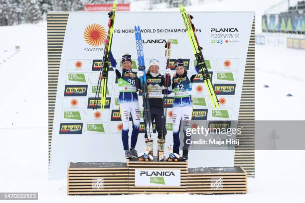 Silver medalist, Frida Karlsson of Sweden, gold medalist, Jessie Diggins of United States and bronze medalist, Ebba Andersson of Sweden celebrate in...