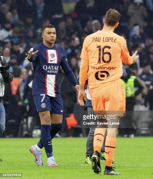 Kylian Mbappe of Paris Saint-Germain react with Pau Lopez of Marseille after the Ligue 1 match between Olympique Marseille and Paris Saint-Germain at...