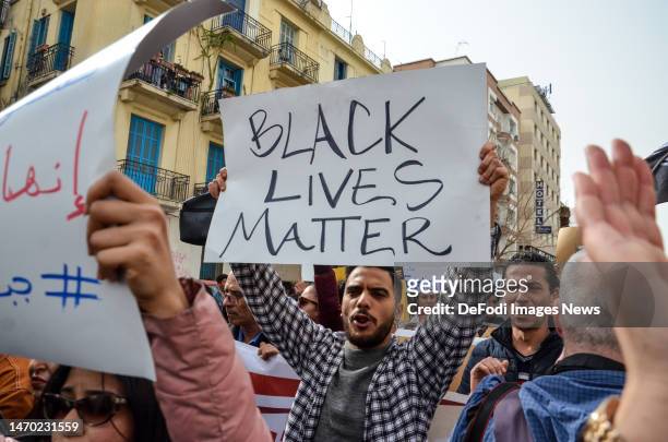 Tunis, Tunisia. 25 February 2023. A man holding a sign that says Black Lives Matter during a demonstration in Tunis to protest against racism and...