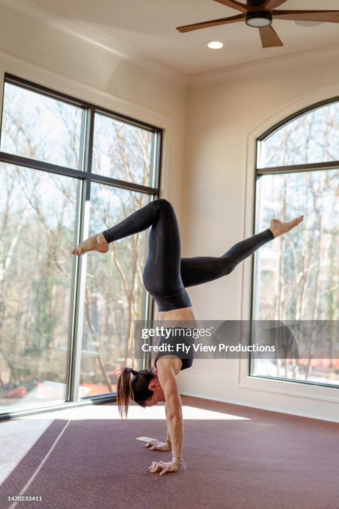 Handstand with stag legs yoga pose