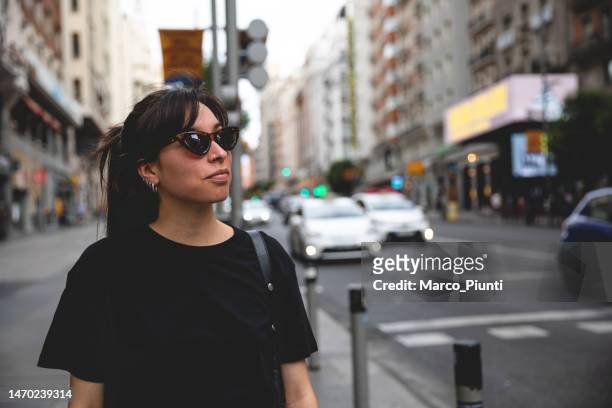 young woman walking in the city - blank t shirt model stock pictures, royalty-free photos & images