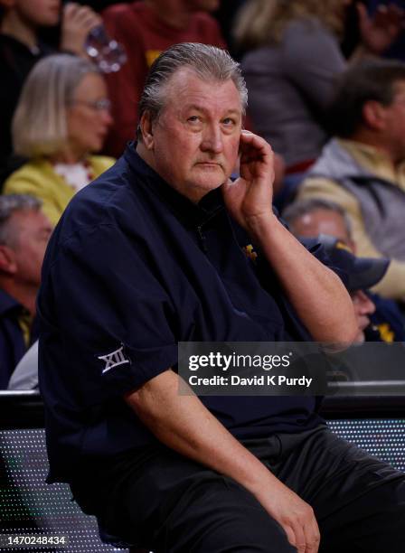 Head coach Bob Huggins of the West Virginia Mountaineers looks at the game clock in the second half of play at Hilton Coliseum on February 27, 2023...