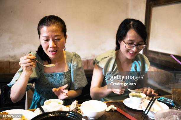 two vietnamese woman eating restaurant at countryside - south east asia stock pictures, royalty-free photos & images
