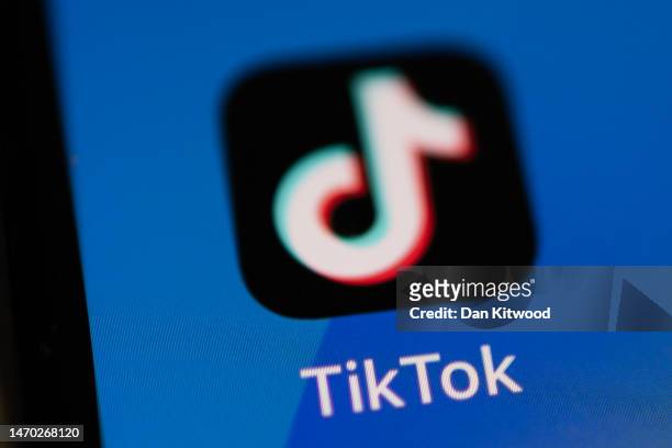 In this photo illustration, the TikTok app logo is displayed on an iPhone on February 28, 2023 in London, England. This week, the US government and...