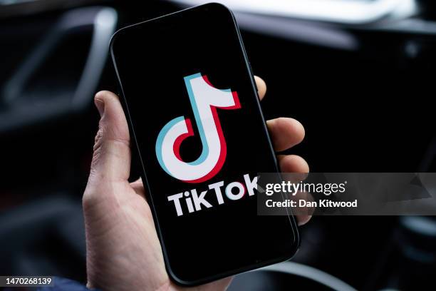 In this photo illustration, a TikTok logo is displayed on an iPhone on February 28, 2023 in London, England. This week, the US government and...