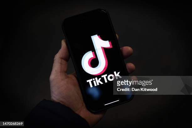 In this photo illustration, a TikTok logo is displayed on an iPhone on February 28, 2023 in London, England. This week, the US government and...