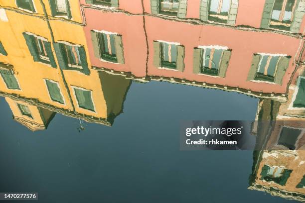 buildings reflected in canal, venice, italy - venice italy canal stock pictures, royalty-free photos & images