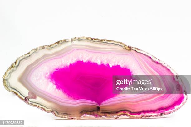 hot pink and semi-transparent agate geode slice crystal,united states,usa - geode stock-fotos und bilder