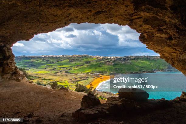 scenic view of sea seen through cave,gozo,malta - malta stock pictures, royalty-free photos & images