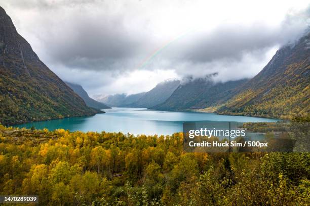 scenic view of lake and mountains against sky,norway - huck stock pictures, royalty-free photos & images