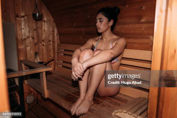 pretty young woman inside a relaxed sauna. - hot arab women stock-fotos und bilder