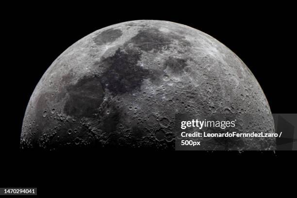 close-up of moon against clear sky at night,guadix,granada,spain - moon stock-fotos und bilder